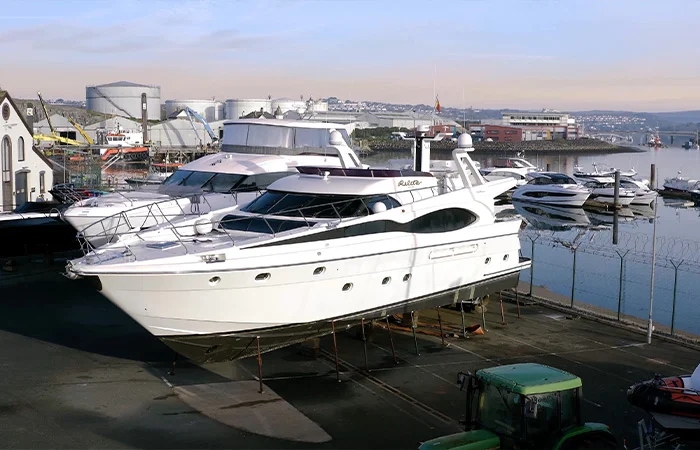 Photo of a yacht on a platform in a boat yard